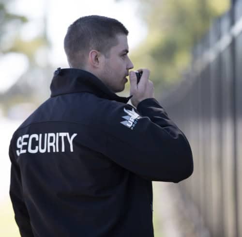 professional security guard talking to base